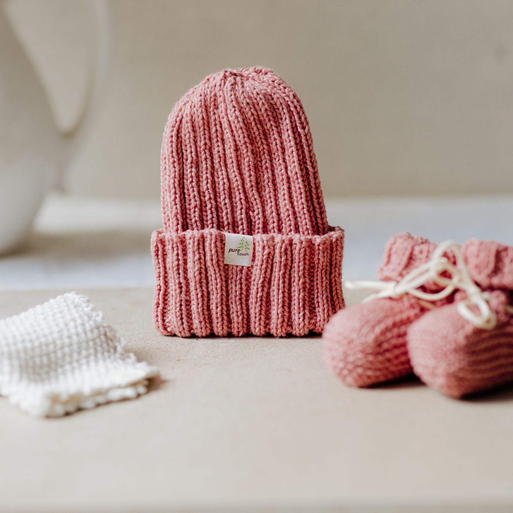 Organic cotton newborn beanie, organic cotton newborn booties with an option to add a baby wash cloth. Color, Pickled Ginger